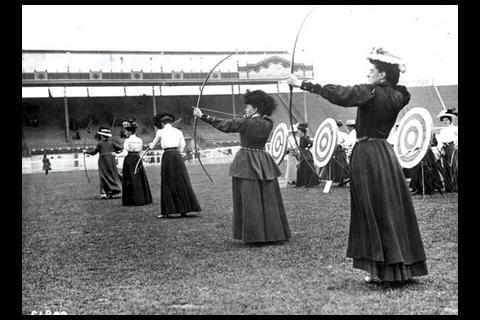 The women’s archery competition. Notice that the competitors have opted to ignore the butts and are firing at the spectators (which explains why there aren’t any)